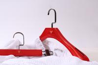 Red color set of garment wooden broad shoulder hanger and pant hanger