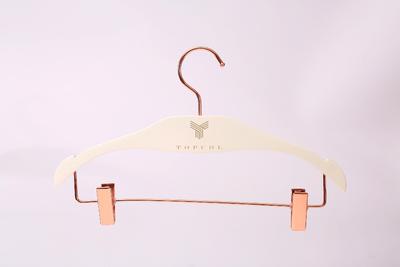 White wooden pants hanger with Copper hook and copper clips
